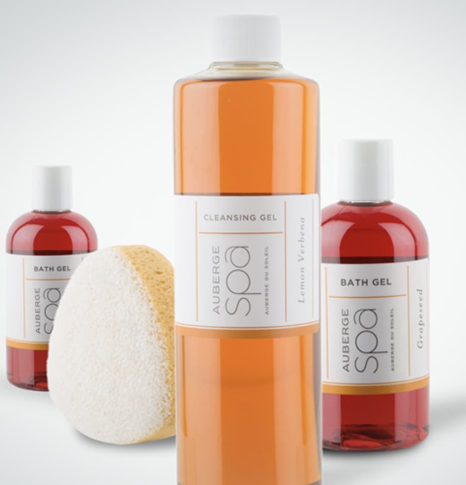 Three soaps and a sponge from the spa at Auberge Resorts & Villas