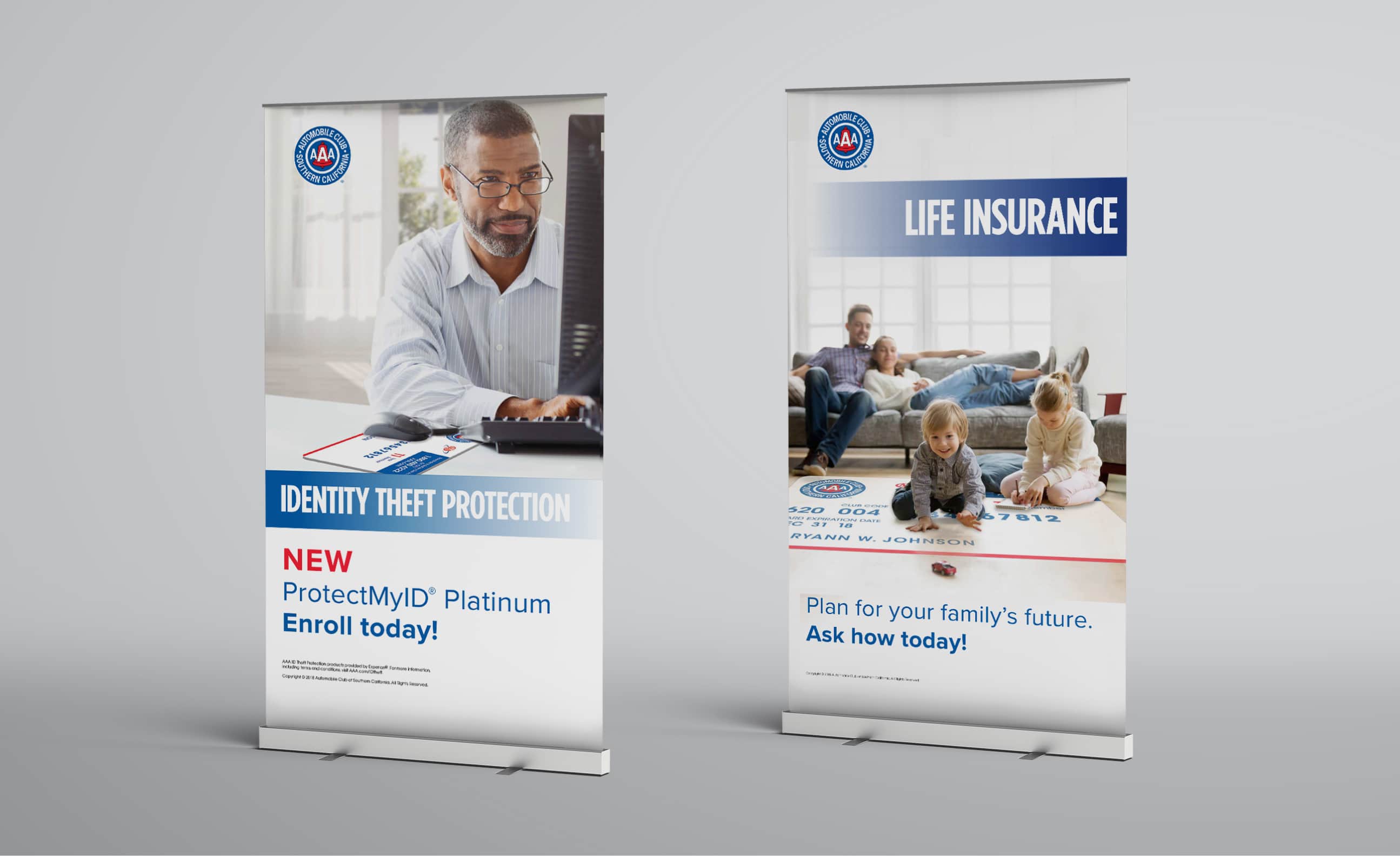 Pull-up banner for identity theft protection featuring a male professional working on a laptop, with the logo of AAA and the text 'NEW ProtectMyID® Platinum Enroll today!' prominently displayed. There is also a stand-up banner for life insurance from AAA showing a family playing together on the floor, with the text 'Plan for your family's future. Ask how today!'