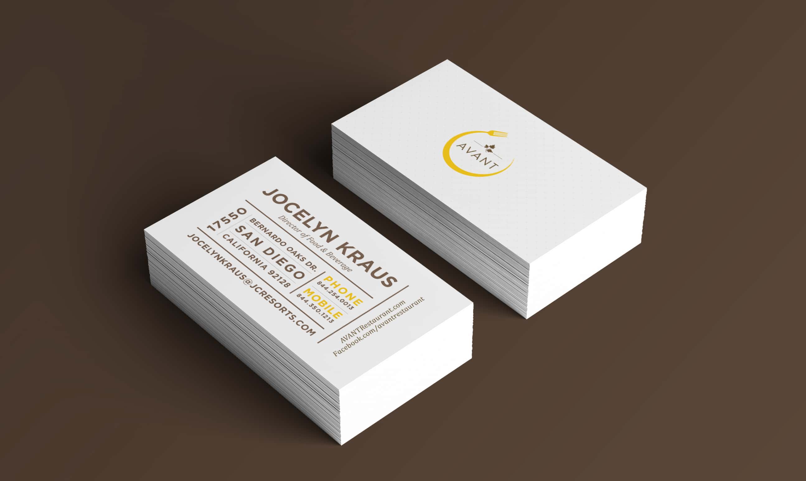 A stack of business cards for AVANT, with contact information and the AVANT logo, displayed on a textured surface.