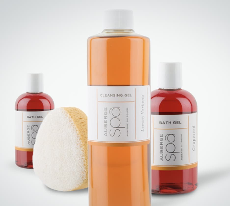 Three soaps and a sponge from the spa at Auberge Resorts & Villas